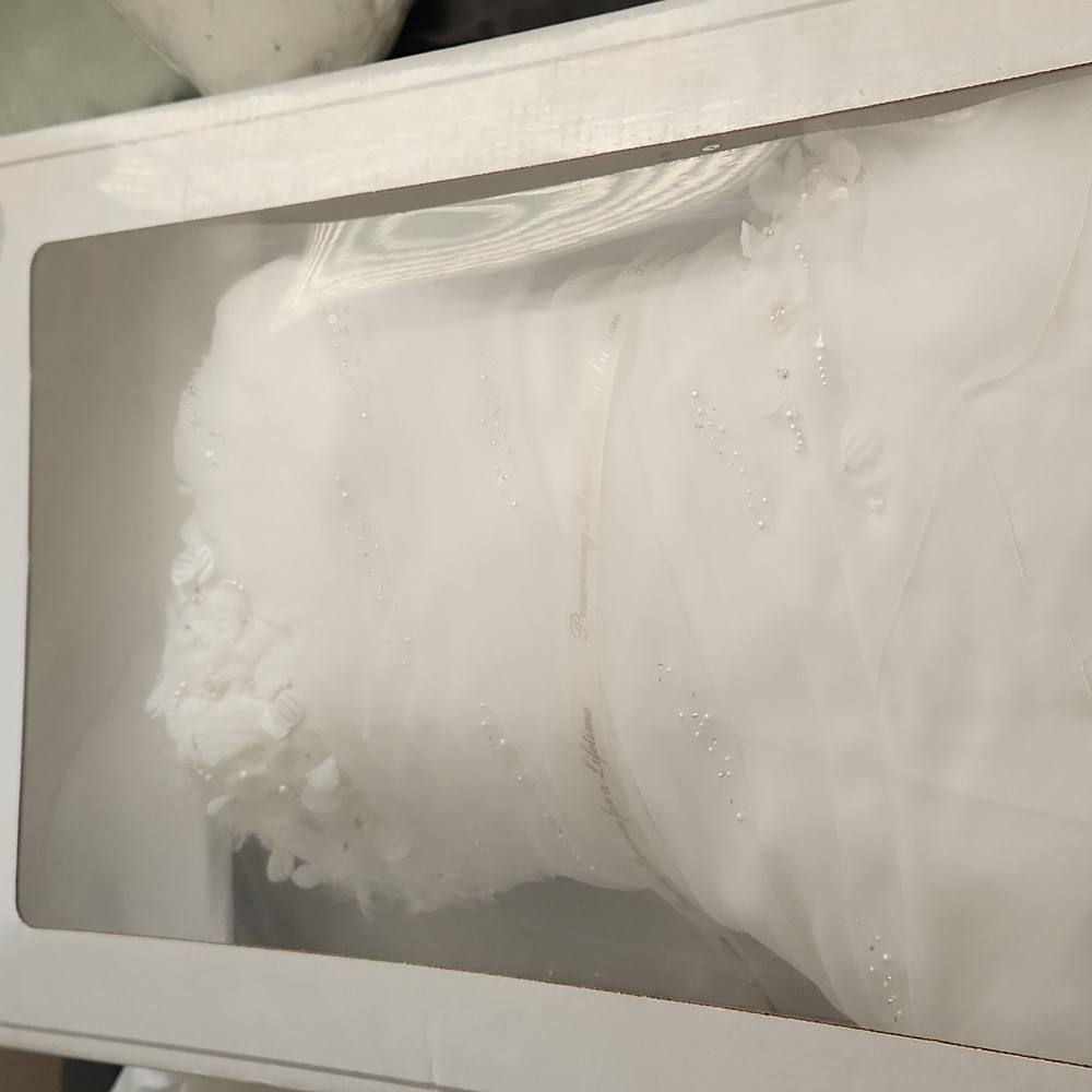 Wedding dress not sure of size as it has been in box since Aug 2012